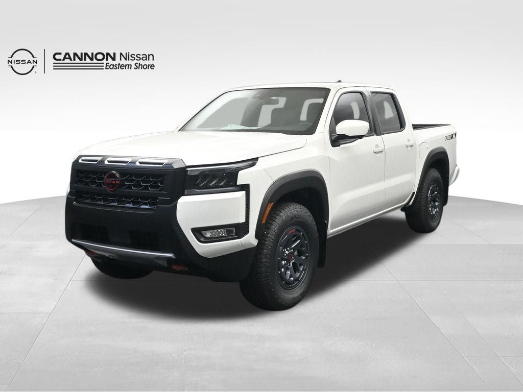 2026 Nissan Frontier PRO-X in Glacier White — front three-quarter view