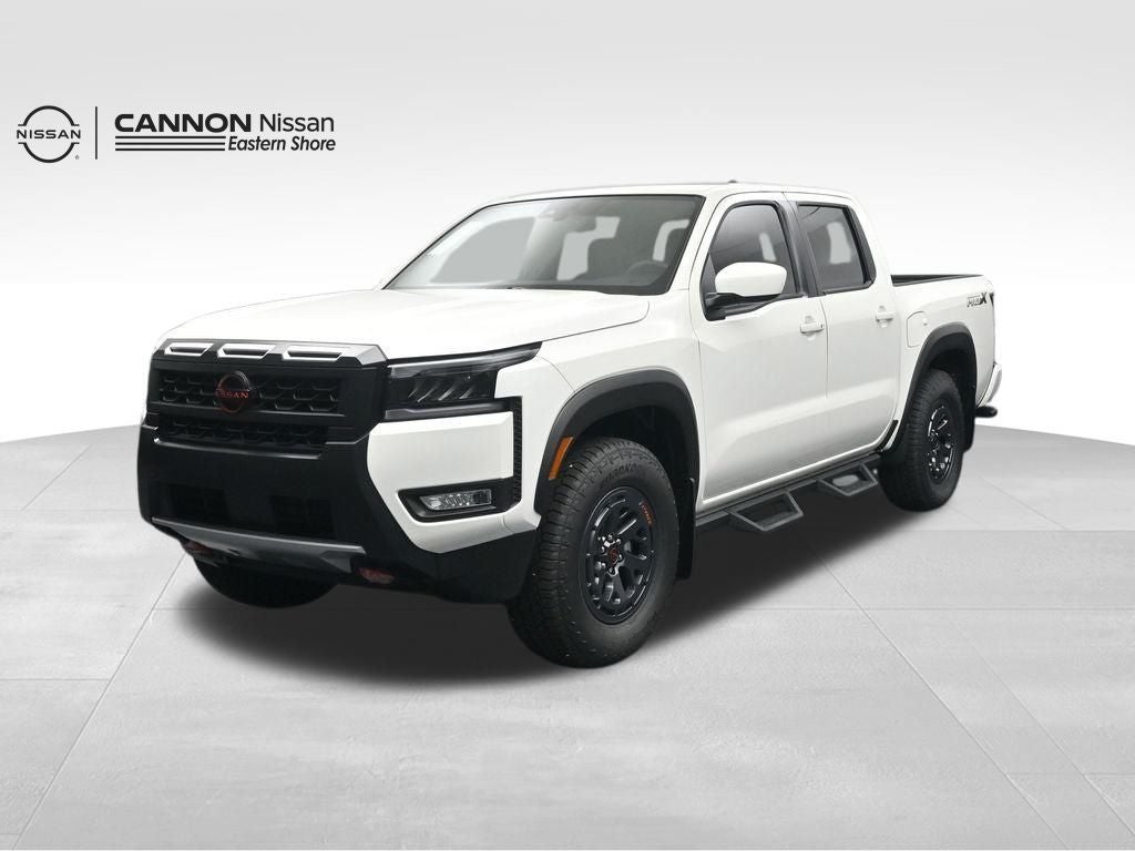 2026 Nissan Frontier PRO-X in Glacier White — front three-quarter view